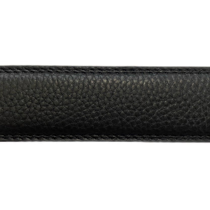 Zoomed in focus on full grain leather belt strap.